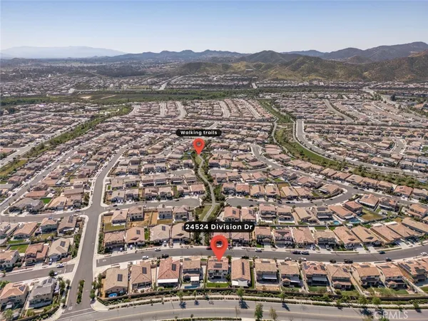 an aerial view of residential building and parking space