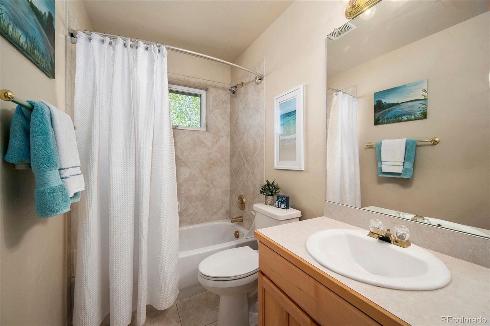 290 Village Road Granby, CO 80446 - Photo 23 of 45 a bathroom with a sink toilet and shower
