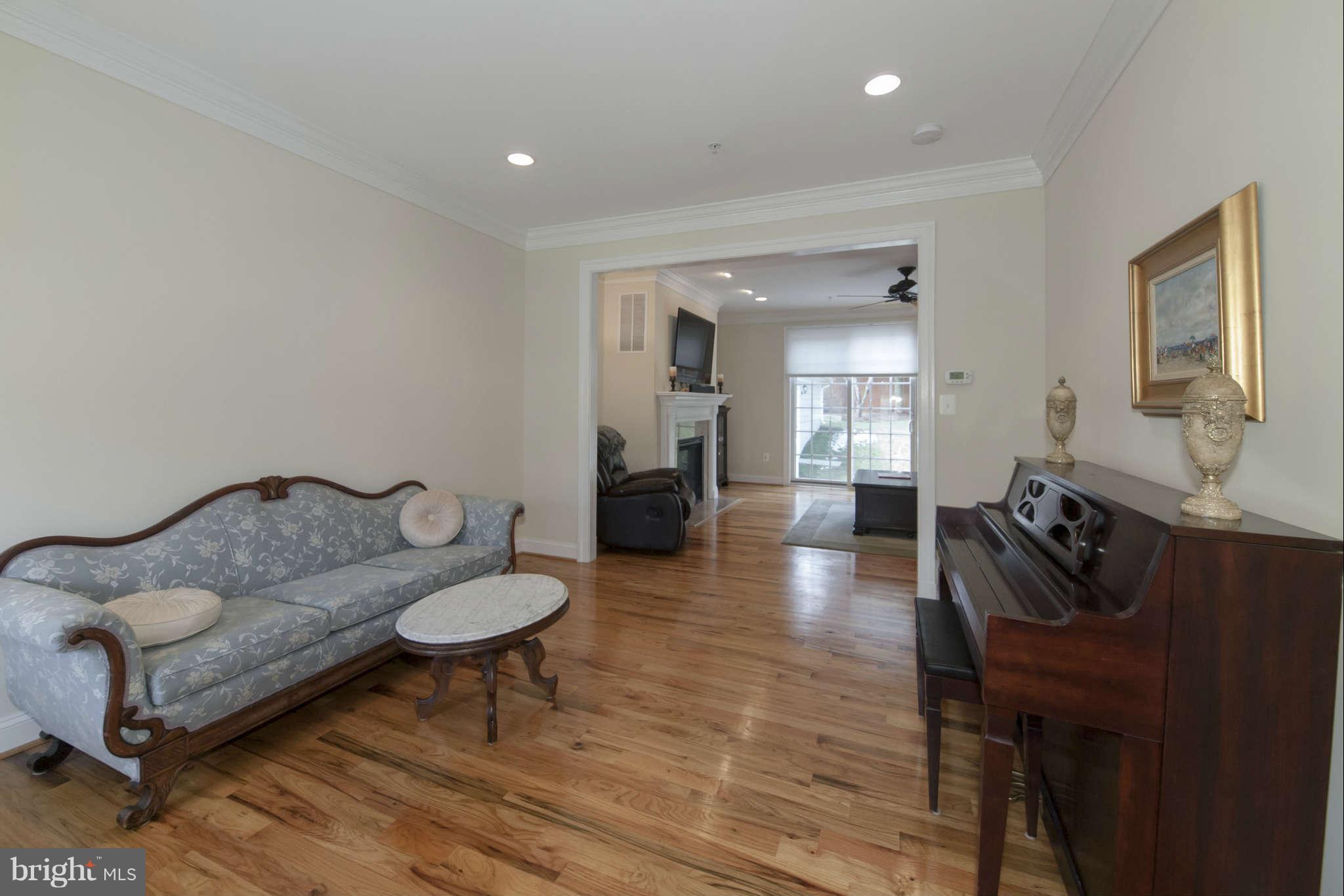 8910 Ridge Place Bethesda, MD 20817 - Photo 14 of 30 a living room with furniture and a wooden floor