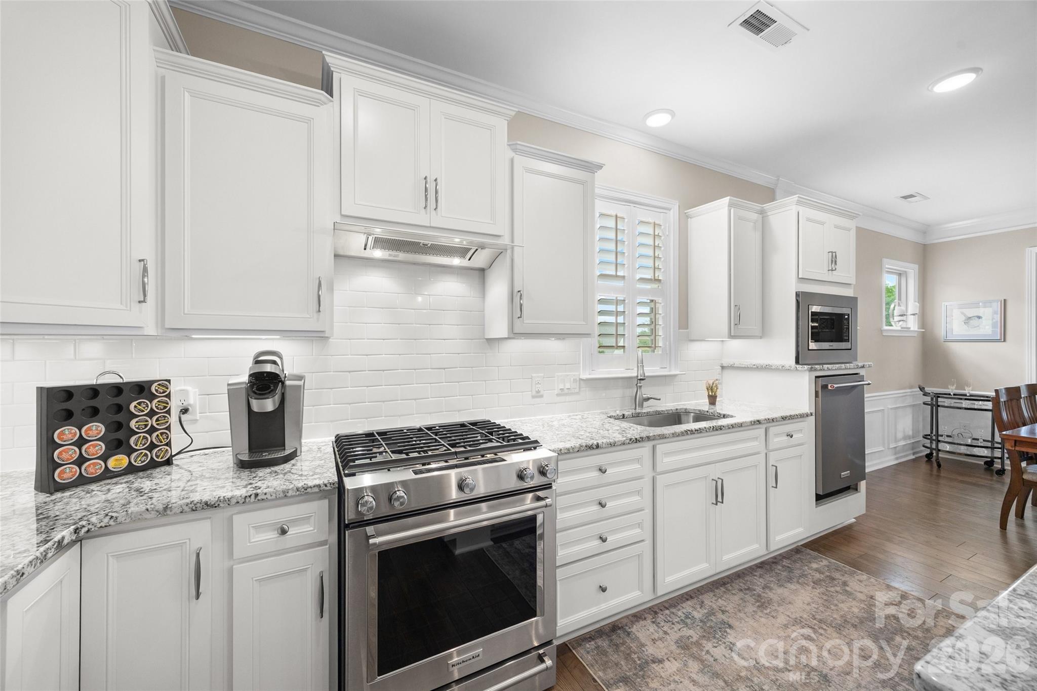 836 Bliss Drive Fort Mill, SC 29715 - Photo 11 of 47 a kitchen with stainless steel appliances granite countertop a sink stove and cabinets