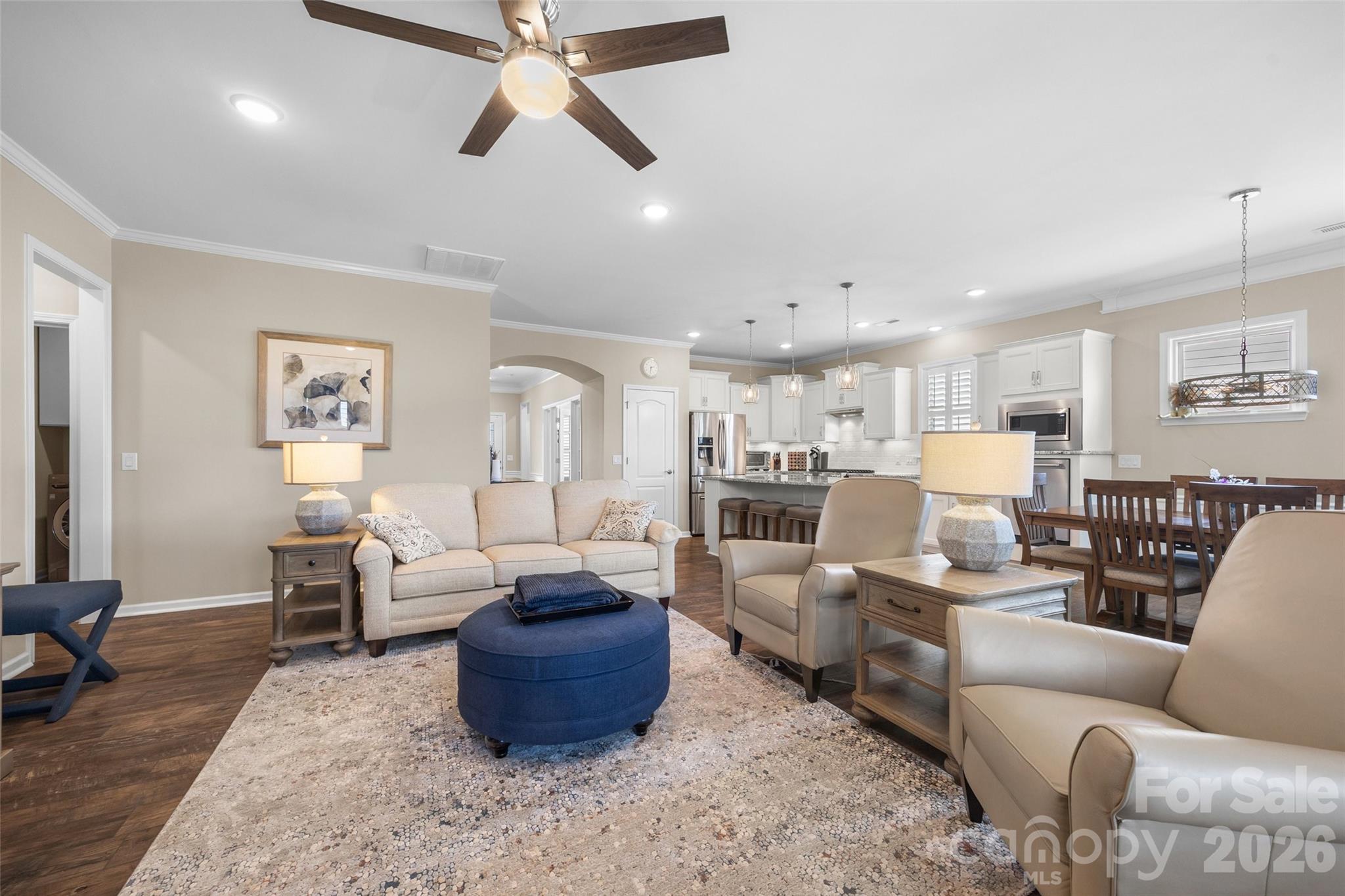 836 Bliss Drive Fort Mill, SC 29715 - Photo 18 of 47 a living room with furniture kitchen view and a chandelier