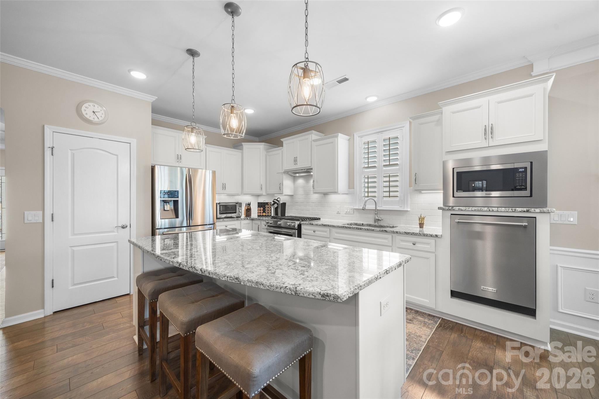 836 Bliss Drive Fort Mill, SC 29715 - Photo 10 of 47 a kitchen with stainless steel appliances granite countertop a sink a stove a refrigerator and island