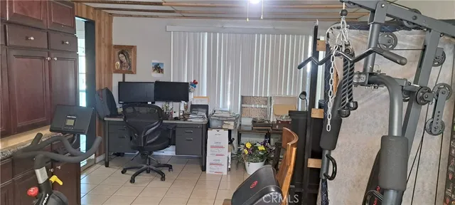 a bedroom with bed and wooden floor