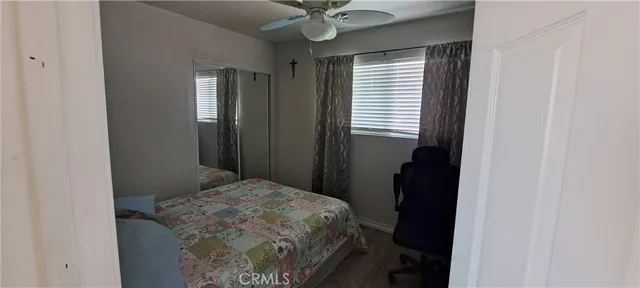 a living room with furniture and a lamp