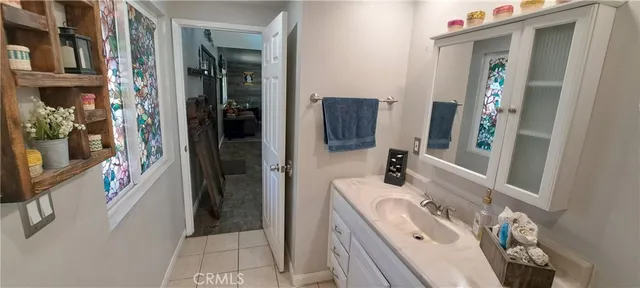 a kitchen with a refrigerator and a stove