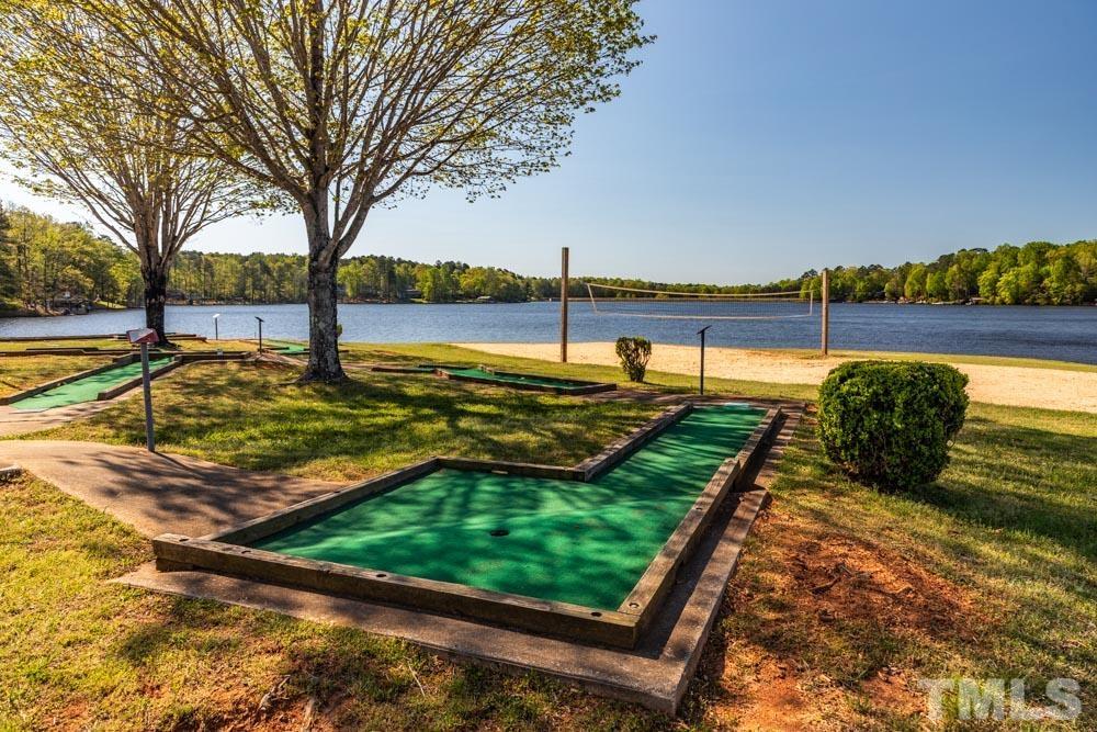 108 Manhato Drive Spring Hope, NC 27882 - Photo 7 of 15 a view of a lake with a yard