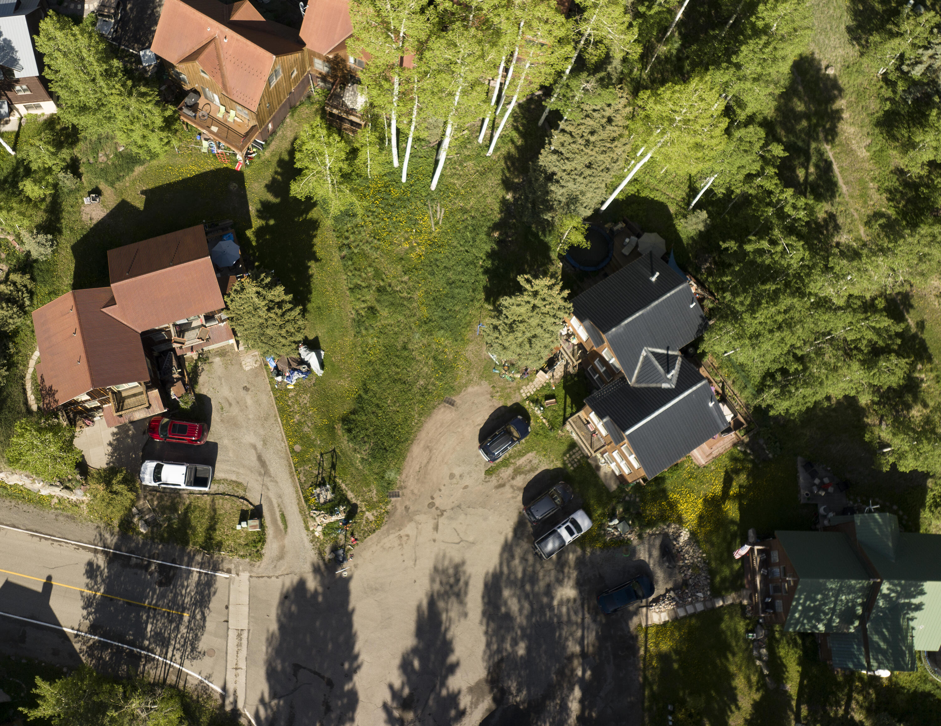 an aerial view of waterside residential houses with outdoor space