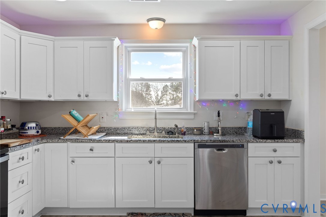 7547 Media Park Road Henrico, VA 23231 - Photo 11 of 24 a kitchen with a sink window and cabinets