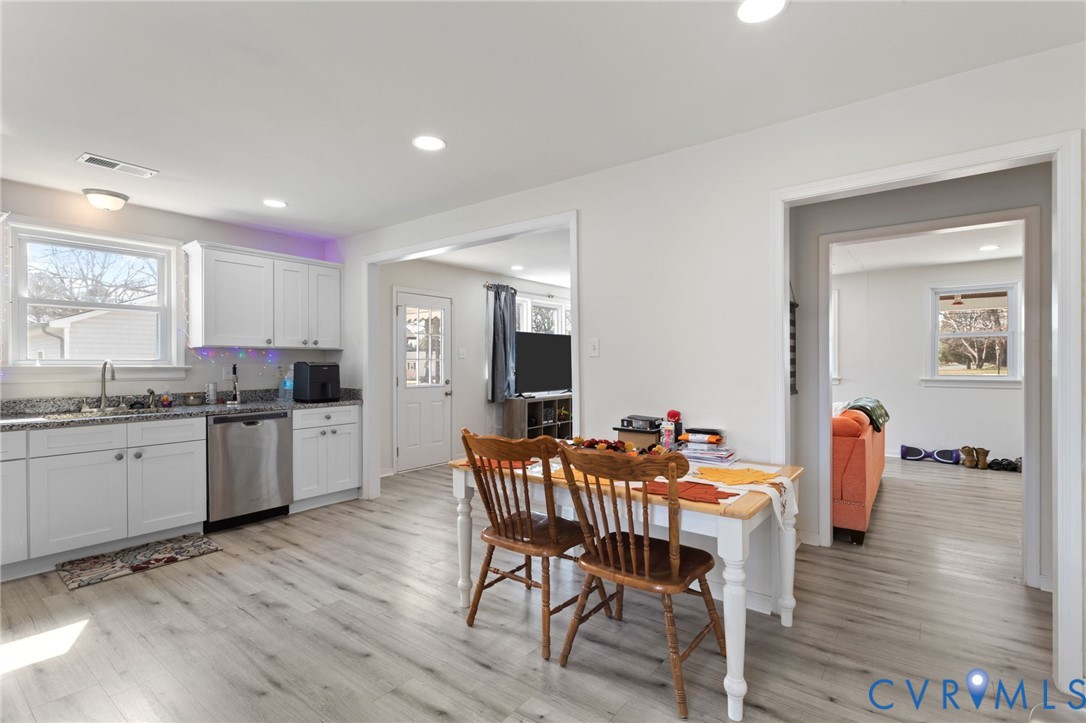 7547 Media Park Road Henrico, VA 23231 - Photo 12 of 24 a kitchen with granite countertop white cabinets and stainless steel appliances