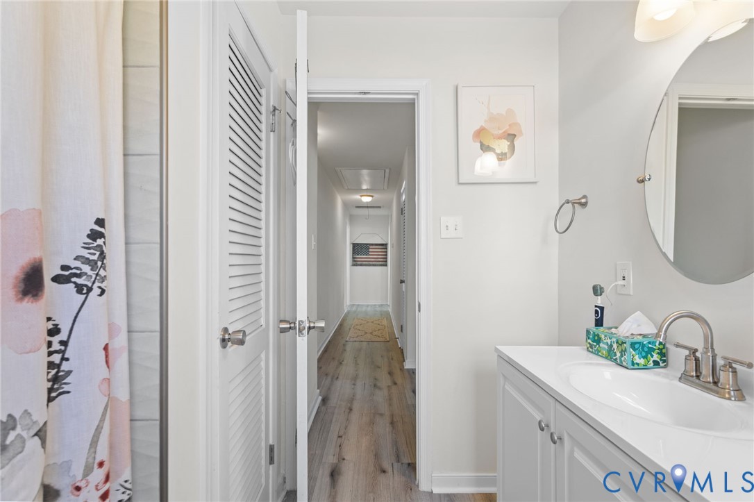 7547 Media Park Road Henrico, VA 23231 - Photo 16 of 24 a bathroom with a sink vanity and a mirror