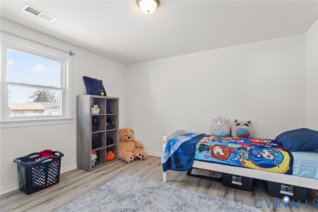 7547 Media Park Road Henrico, VA 23231 - Photo 18 of 24 a bedroom with bed and a window