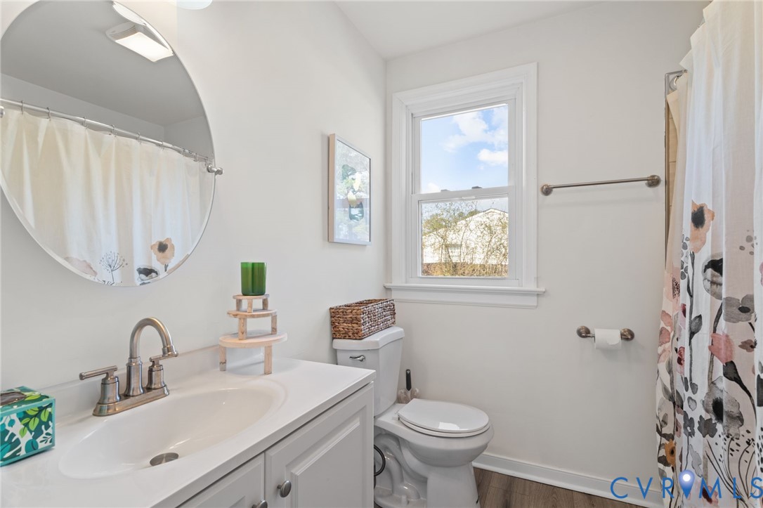 7547 Media Park Road Henrico, VA 23231 - Photo 2 of 24 a bathroom with a sink toilet a mirror and shower