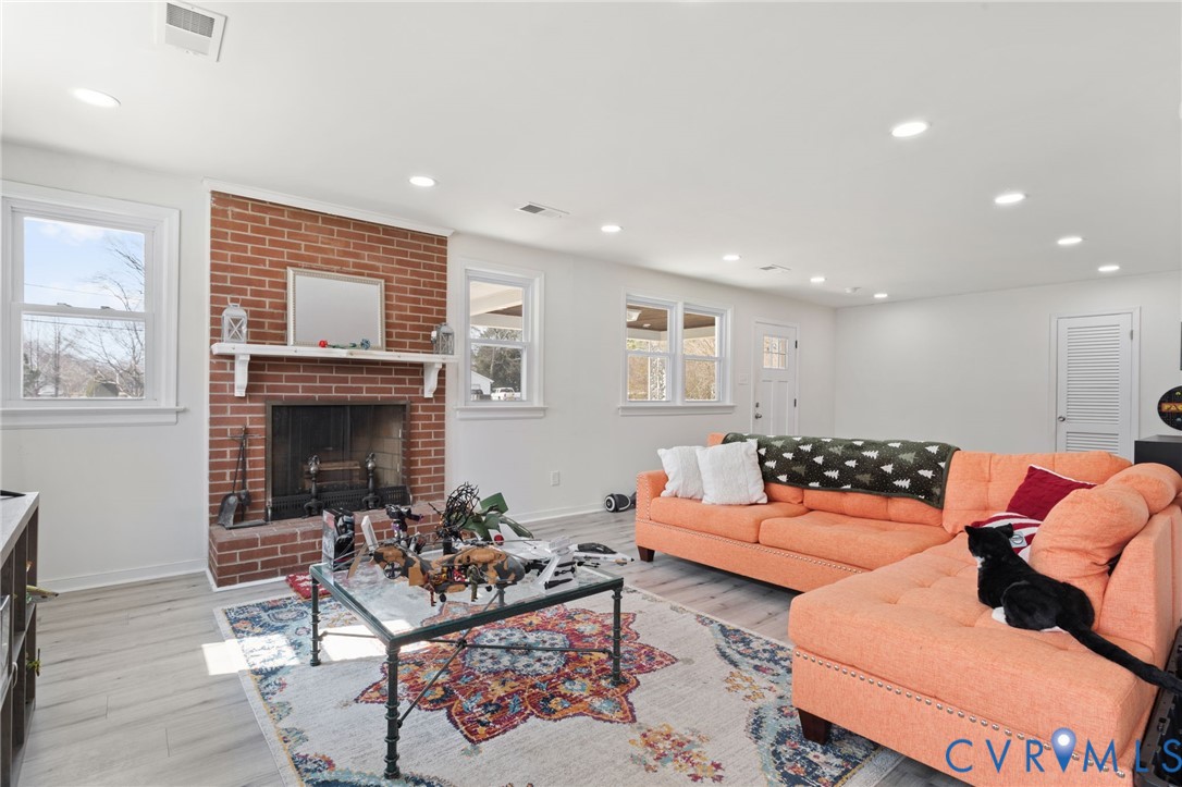 7547 Media Park Road Henrico, VA 23231 - Photo 3 of 24 a living room with furniture and a fireplace