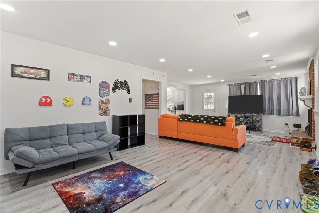 7547 Media Park Road Henrico, VA 23231 - Photo 6 of 24 a living room with furniture and a flat screen tv