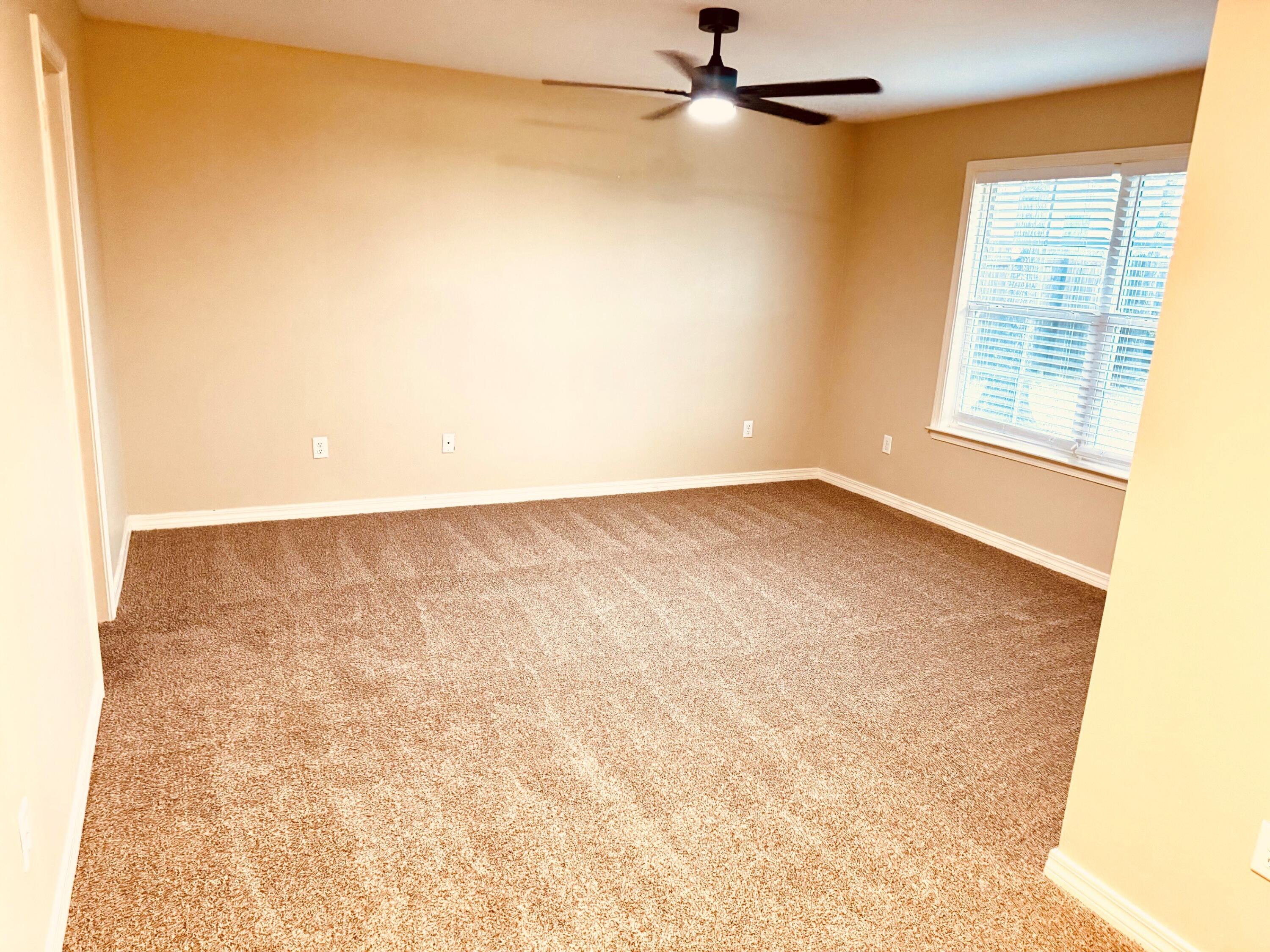594 Hunters Ridge Road DeFuniak Springs, FL 32433 - Photo 7 of 17 an empty room with a window and a ceiling fan