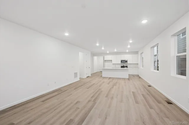 a view of a livingroom with wooden floor