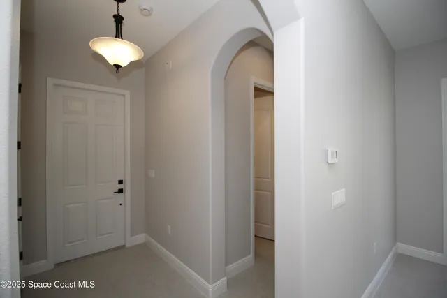a view of entryway with chandelier
