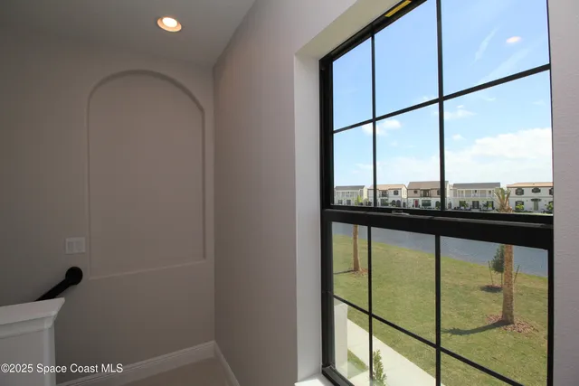 a view of a glass door and a window