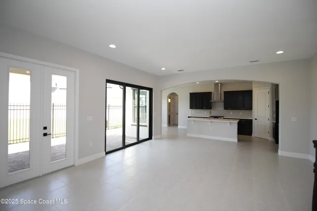 a view of a livingroom with an empty space and a fireplace