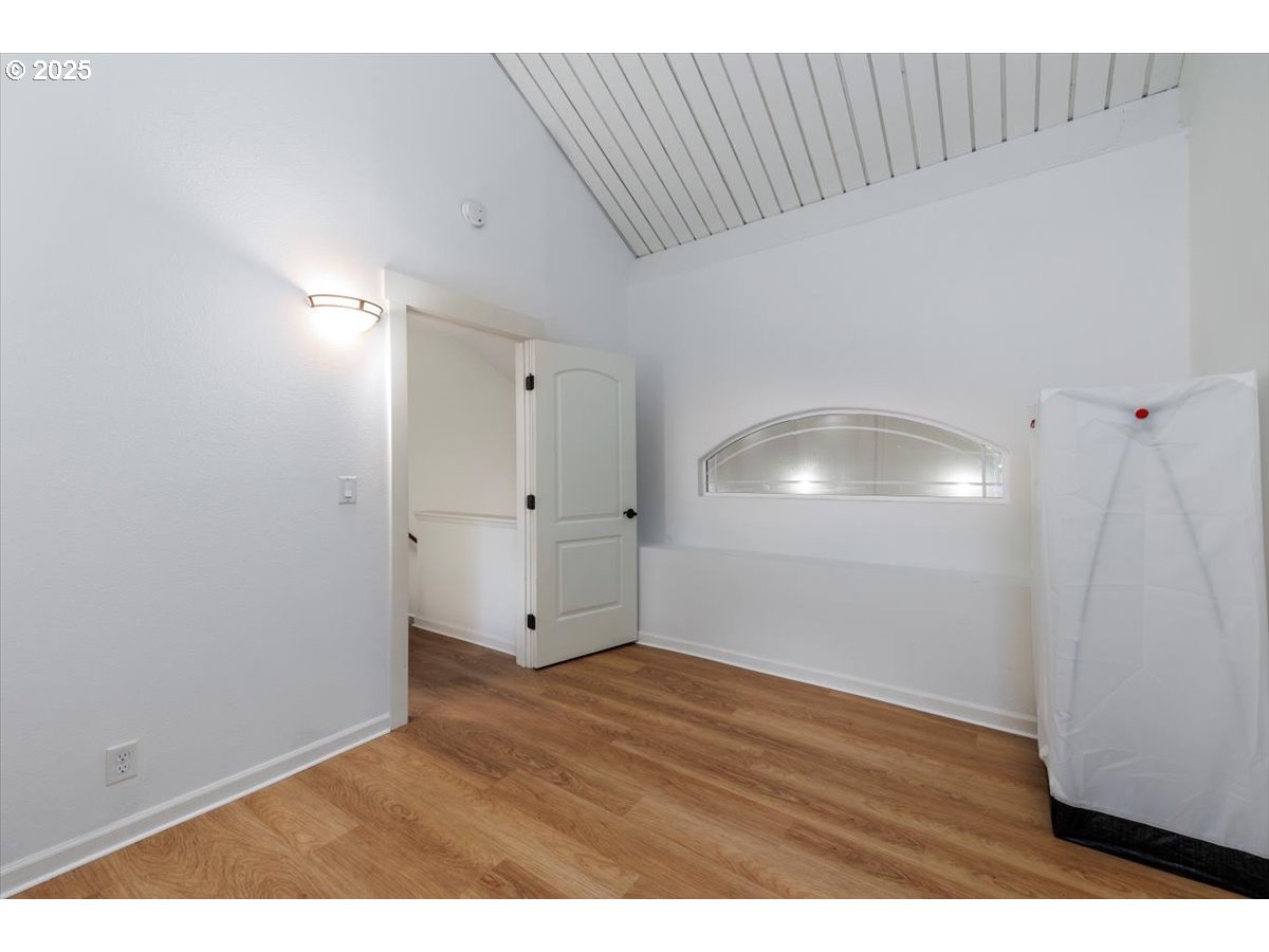 100 Kerr Parkway, Unit 34 Lake Oswego, OR 97035 - Photo 23 of 35 a view of an empty room with wooden floor