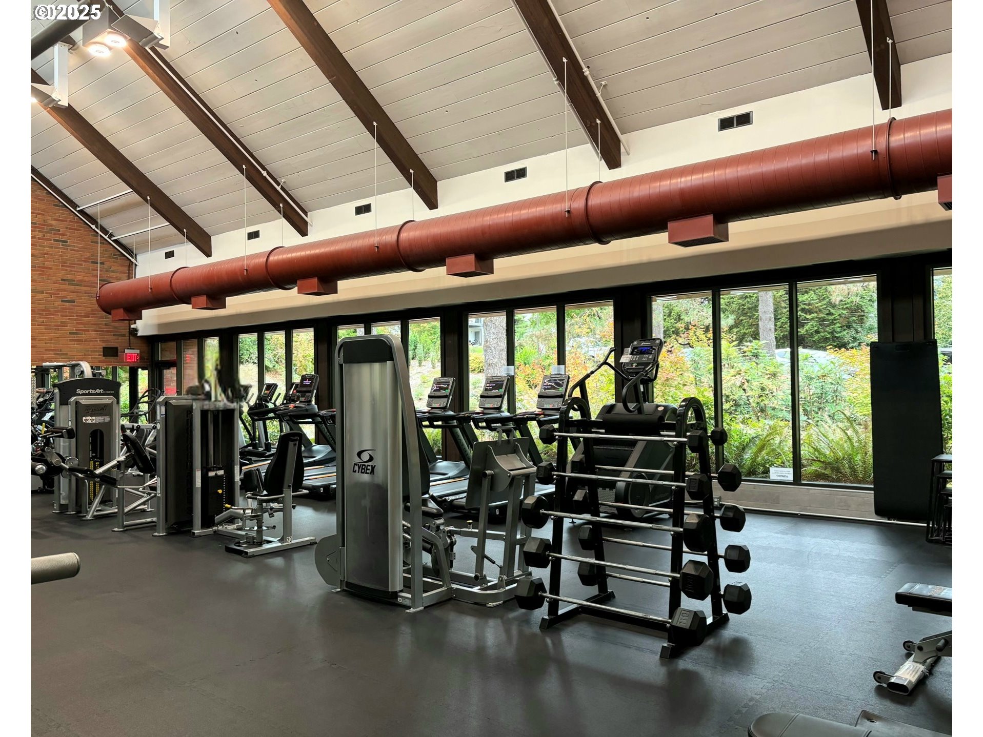100 Kerr Parkway, Unit 34 Lake Oswego, OR 97035 - Photo 35 of 35 a room with gym equipment and large glass windows
