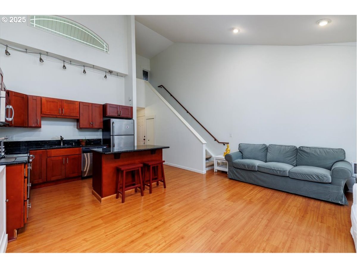 100 Kerr Parkway, Unit 34 Lake Oswego, OR 97035 - Photo 8 of 35 a living room with furniture and a kitchen view