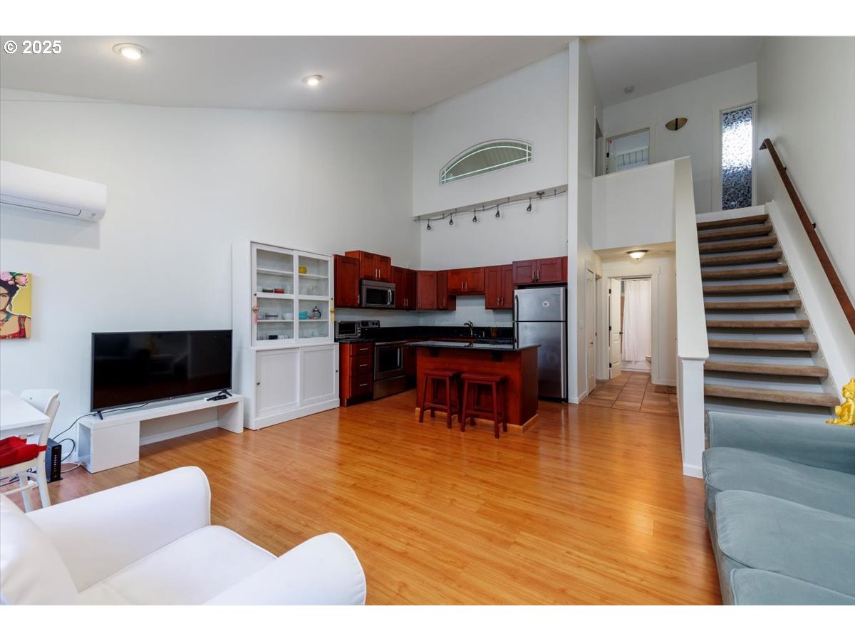 100 Kerr Parkway, Unit 34 Lake Oswego, OR 97035 - Photo 9 of 35 a living room with furniture and a flat screen tv