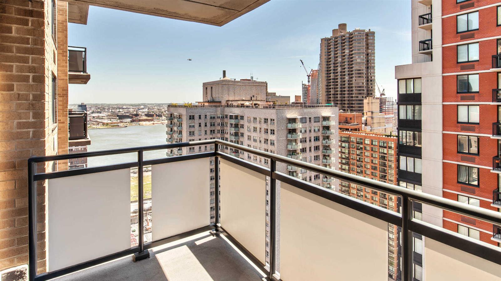 245 East 40th Street, Unit 24J Manhattan, NY 10016 - Photo 2 of 10 a view of a balcony with city view