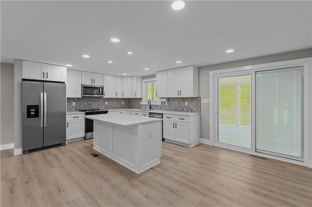 309 Vaneal Road Washington, PA 15301 - Photo 8 of 30 a kitchen with white cabinets and stainless steel appliances