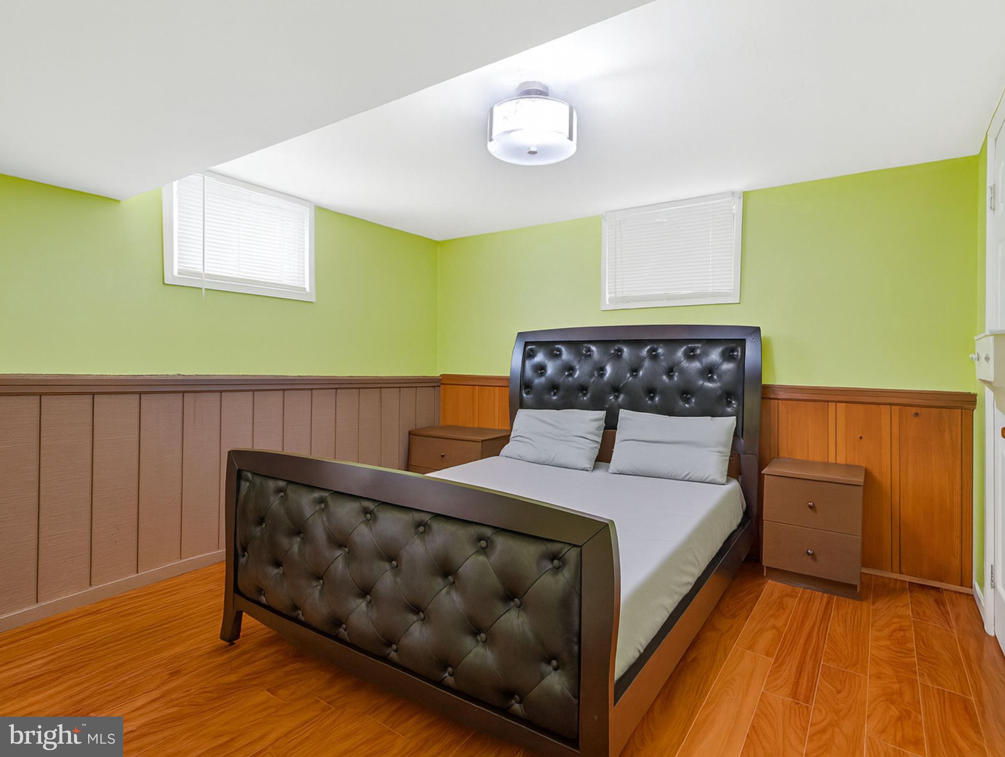 7314 Powhatan Street Lanham, MD 20706 - Photo 15 of 19 a bedroom with a bed and painting on the wall