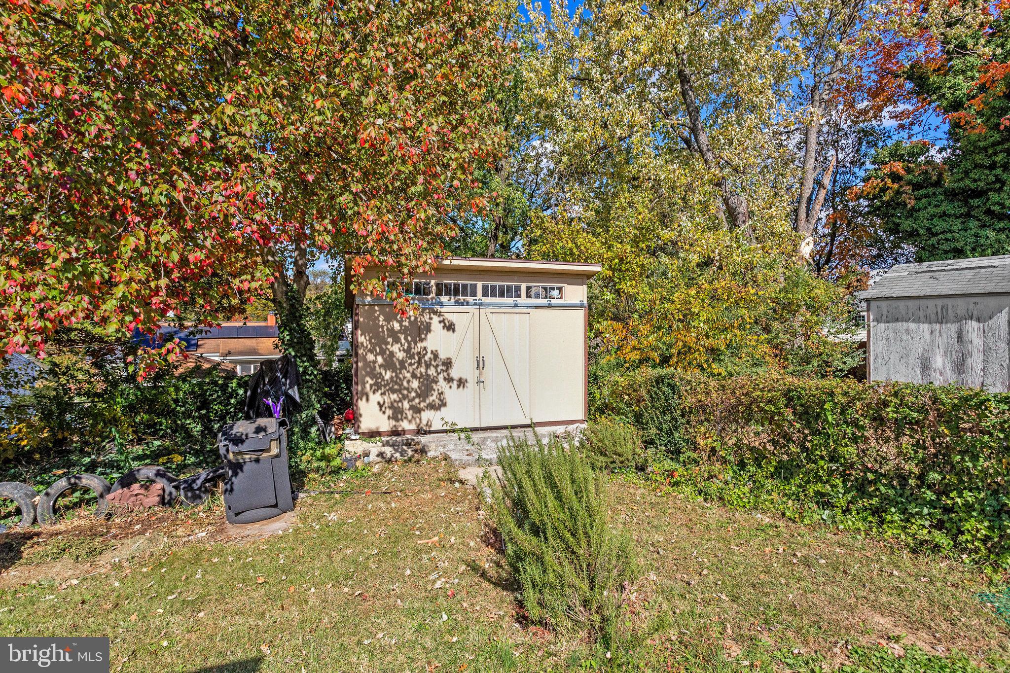 7314 Powhatan Street Lanham, MD 20706 - Photo 18 of 19 a sign board with tall trees