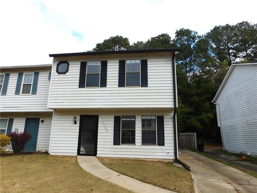 3589 North Hopkins Court Powder Springs, GA 30127 - Photo 1 of 17 a front view of a house with a garage
