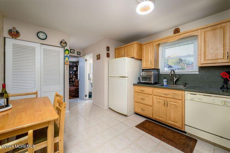 42 Westbrook Road Howell, NJ 07731 - Photo 7 of 43 a kitchen with stainless steel appliances a refrigerator sink and cabinets
