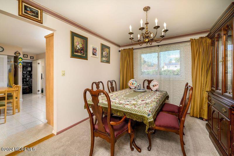 42 Westbrook Road Howell, NJ 07731 - Photo 10 of 43 a view of a dining room with furniture window and outside view