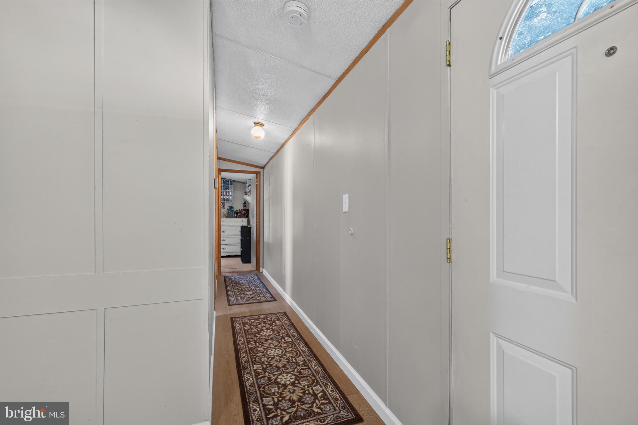 8 West Reybold Drive, Unit 8 Middletown, DE 19709 - Photo 23 of 30 Inviting hallway with warm ambiance.