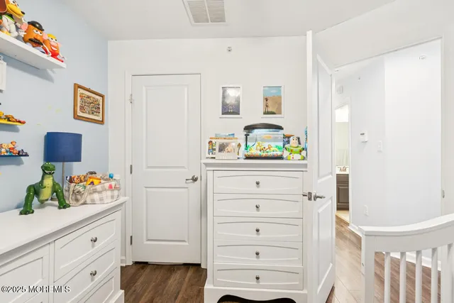 a view of a workspace with furniture and wooden floor