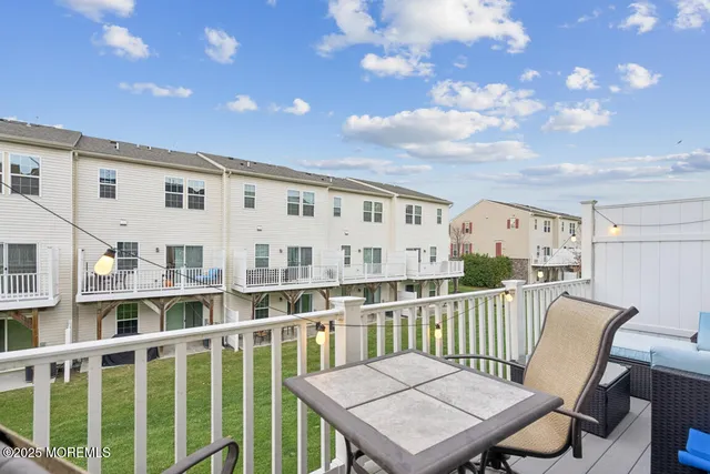 a view of a balcony with furniture