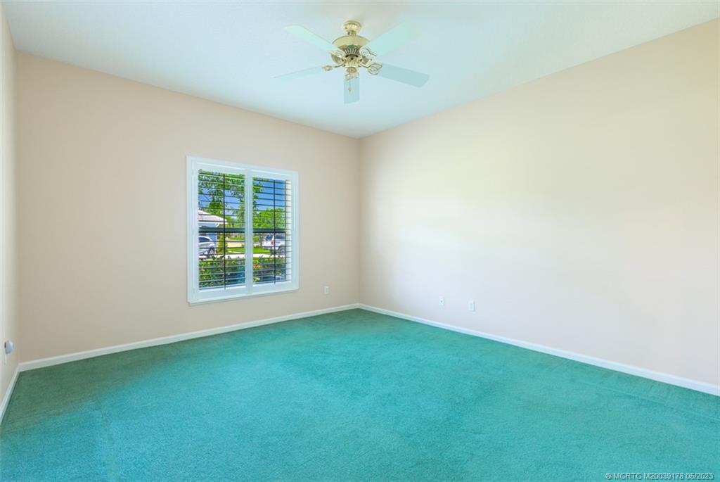 2642 Northwest S Shore Road Stuart, FL 34994 - Photo 22 of 40 an empty room with a window and a ceiling fan