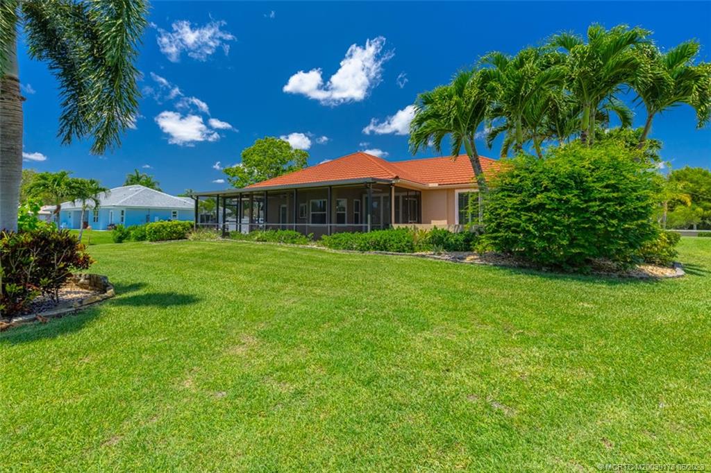 2642 Northwest S Shore Road Stuart, FL 34994 - Photo 28 of 40 a view of a house with a yard