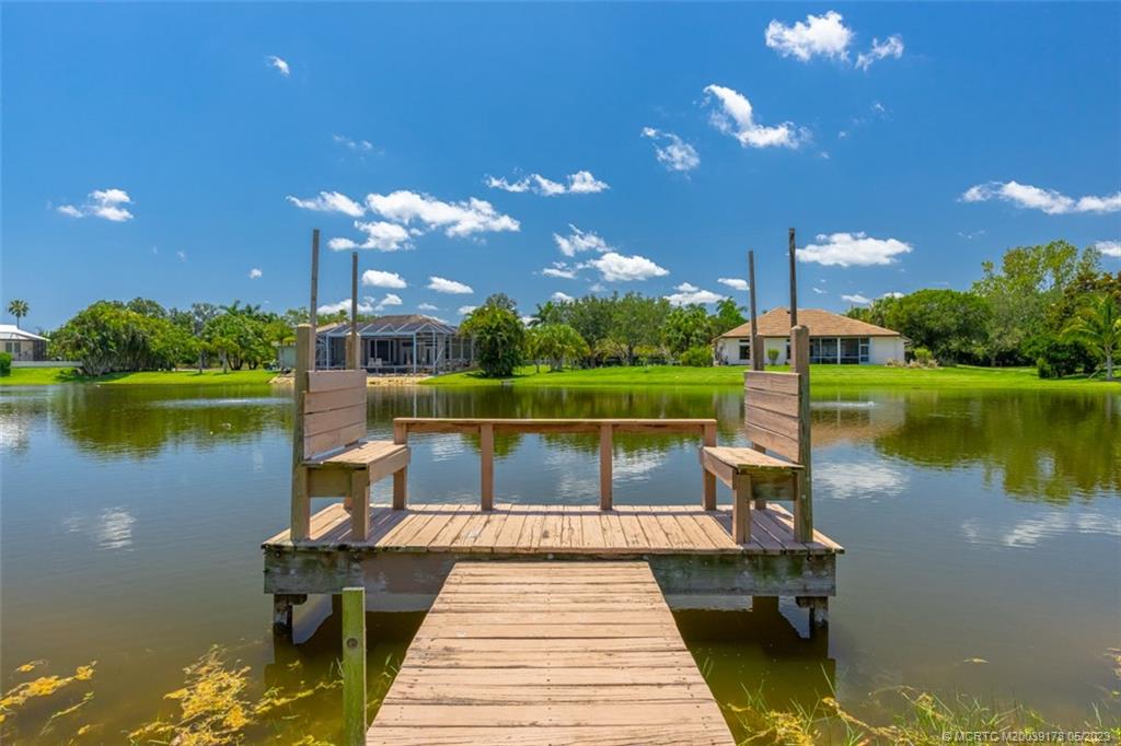 2642 Northwest S Shore Road Stuart, FL 34994 - Photo 32 of 40 a view of a lake with a garden