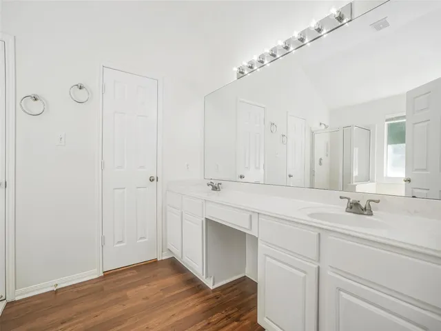 a view of bathroom with dual sinks