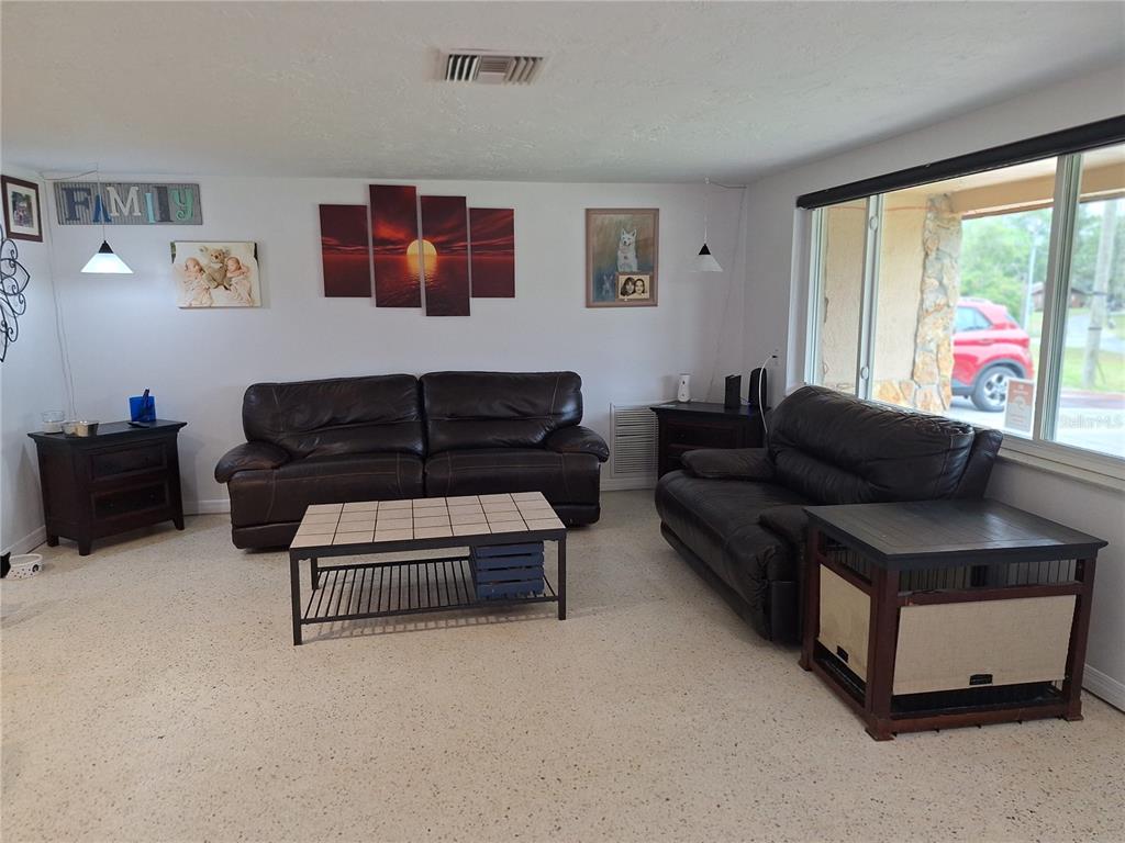 9415 Indale Drive New Port Richey, FL 34654 - Photo 12 of 93 a living room with furniture and a window