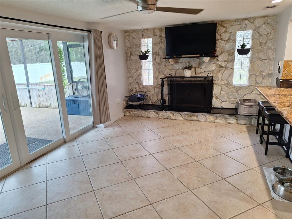 9415 Indale Drive New Port Richey, FL 34654 - Photo 23 of 93 a view of living room with furniture and flat screen tv