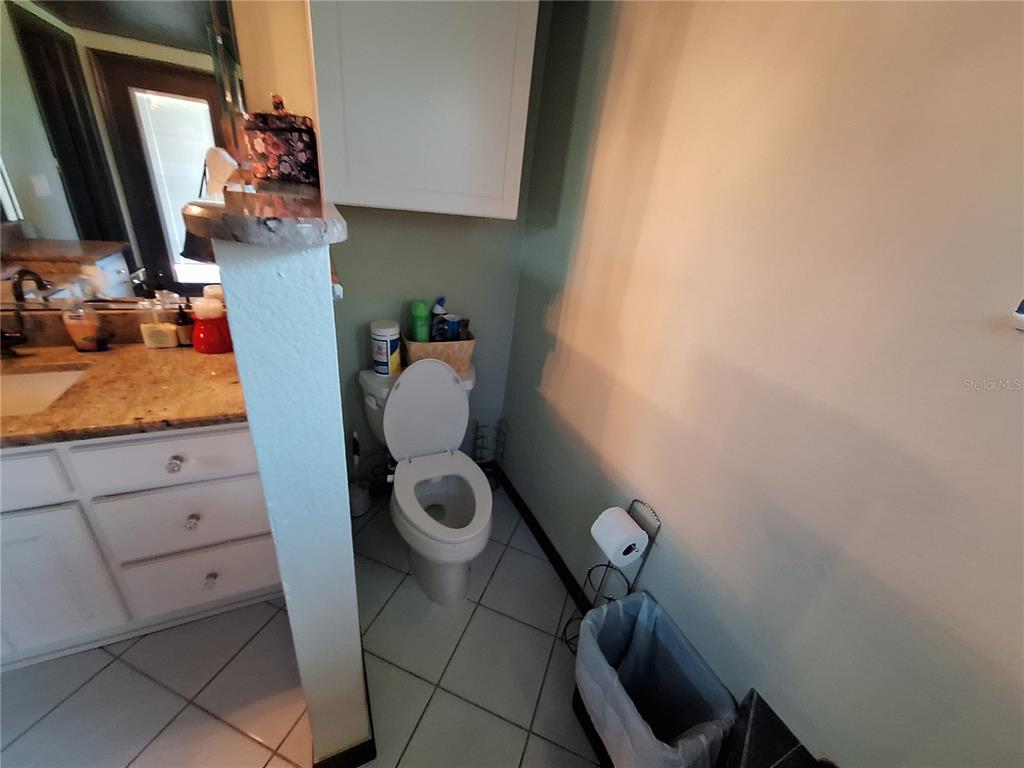 9415 Indale Drive New Port Richey, FL 34654 - Photo 37 of 93 a bathroom with a toilet and a sink