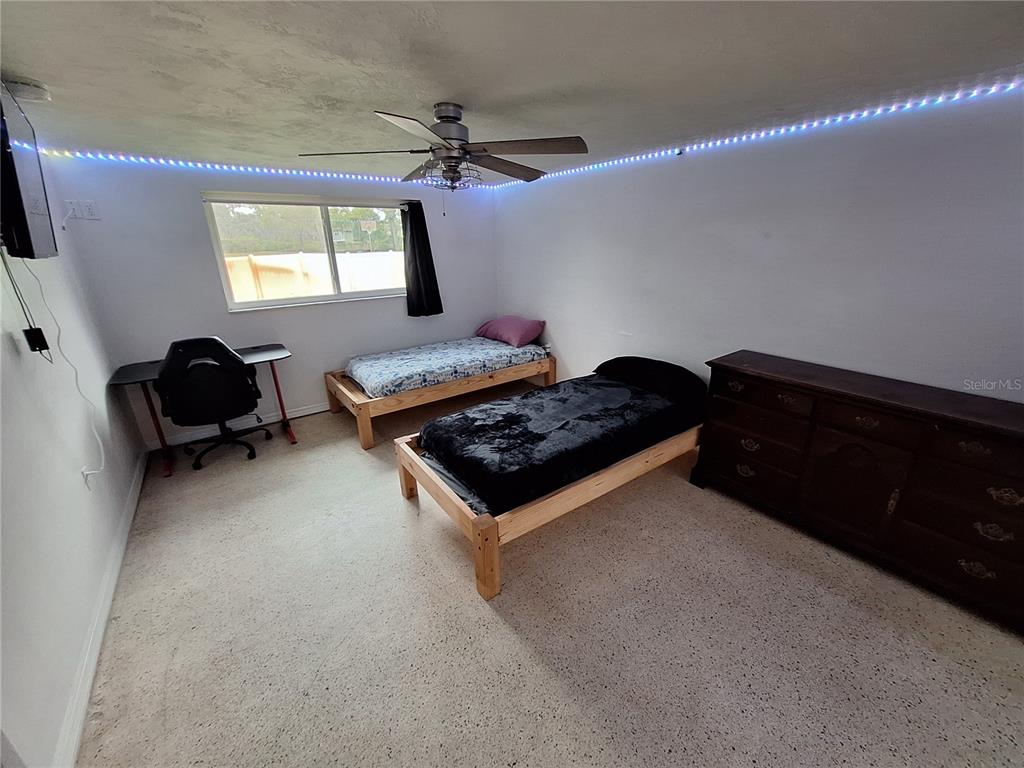 9415 Indale Drive New Port Richey, FL 34654 - Photo 39 of 93 a living room with furniture and a window