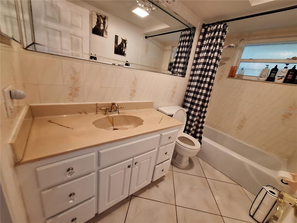 9415 Indale Drive New Port Richey, FL 34654 - Photo 43 of 93 a bathroom with a sink a toilet and shower