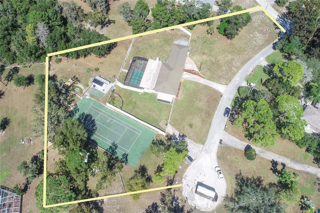 9415 Indale Drive New Port Richey, FL 34654 - Photo 54 of 93 an aerial view of a house with a yard and potted plants