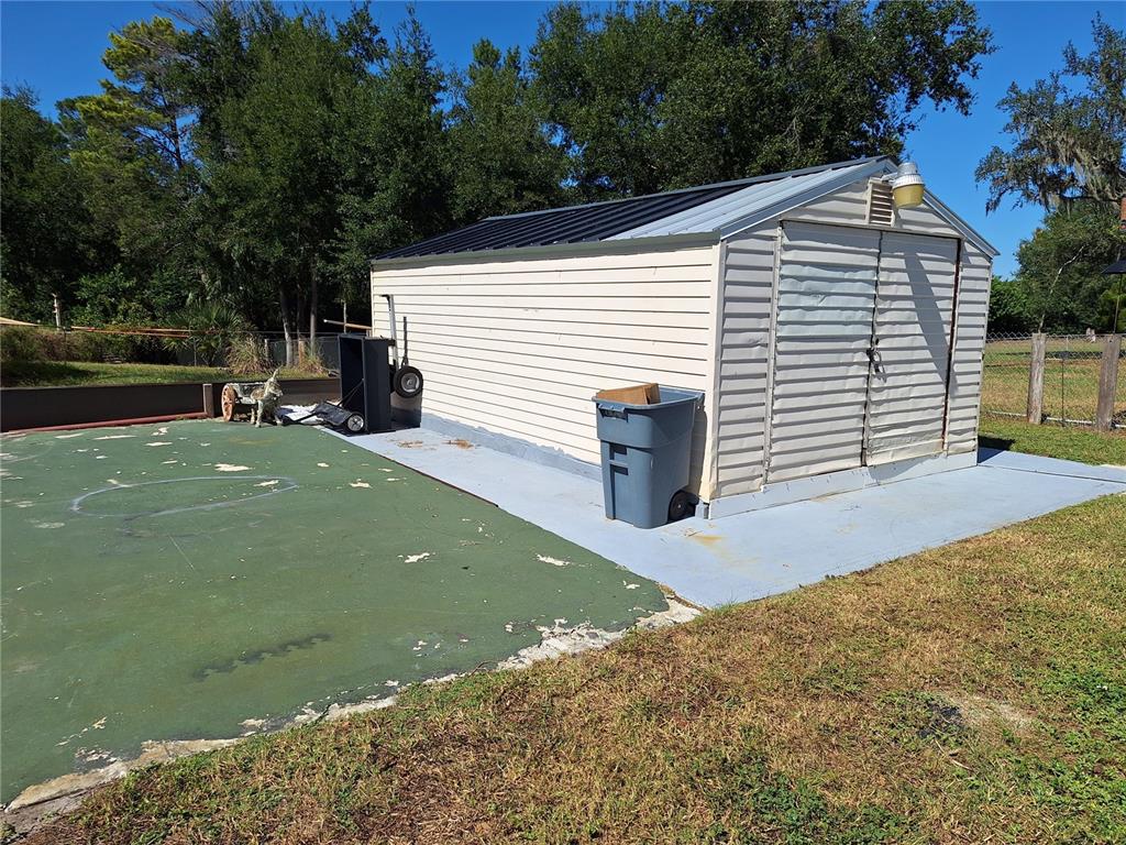 9415 Indale Drive New Port Richey, FL 34654 - Photo 60 of 93 a front view of a house with a yard