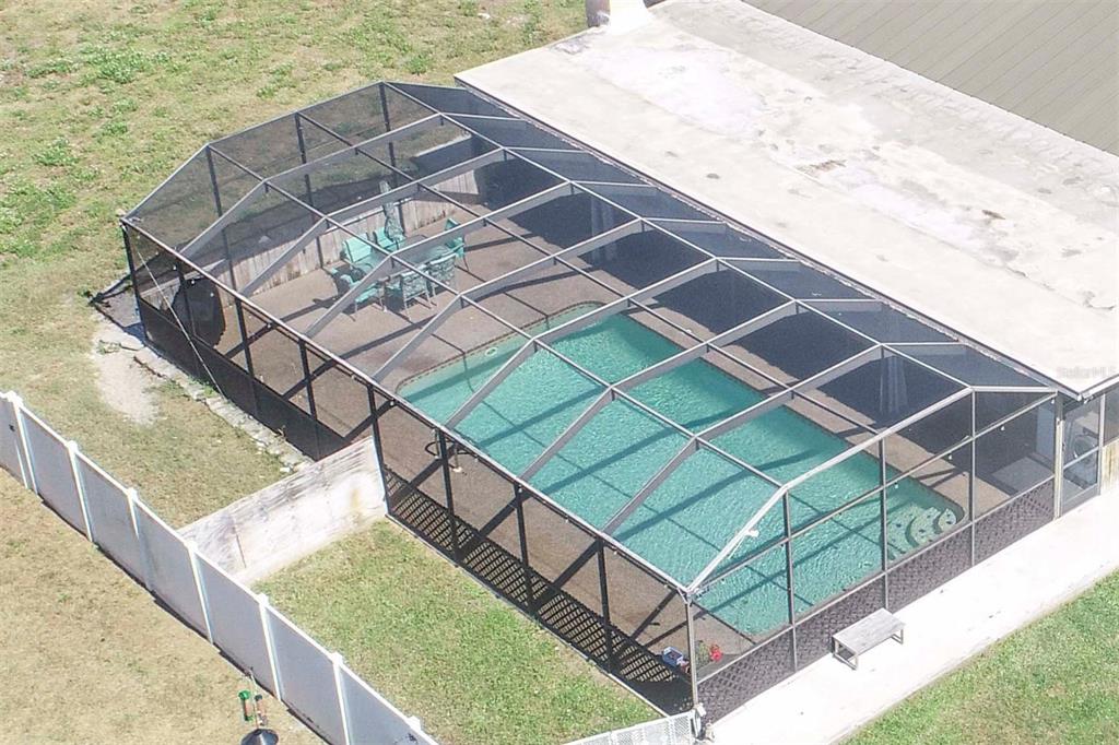 9415 Indale Drive New Port Richey, FL 34654 - Photo 7 of 93 a view of a roof deck with wooden floor and fence