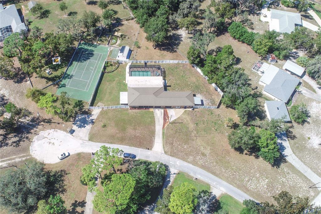 9415 Indale Drive New Port Richey, FL 34654 - Photo 92 of 93 an aerial view of a house with a yard